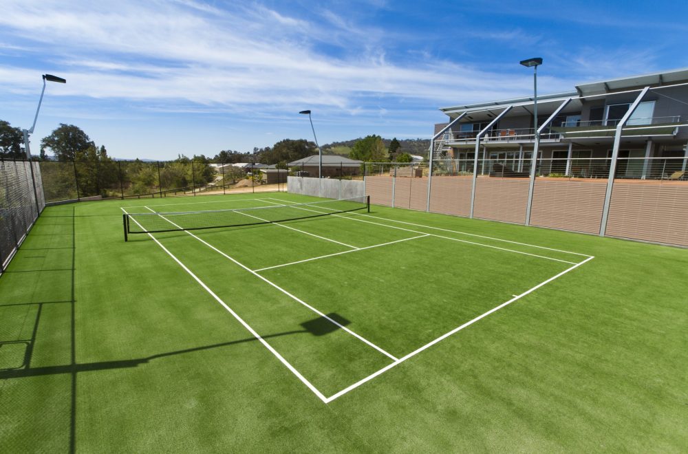 Canchas de tenis con pasto sintético Durabilidad y bajo mantenimiento